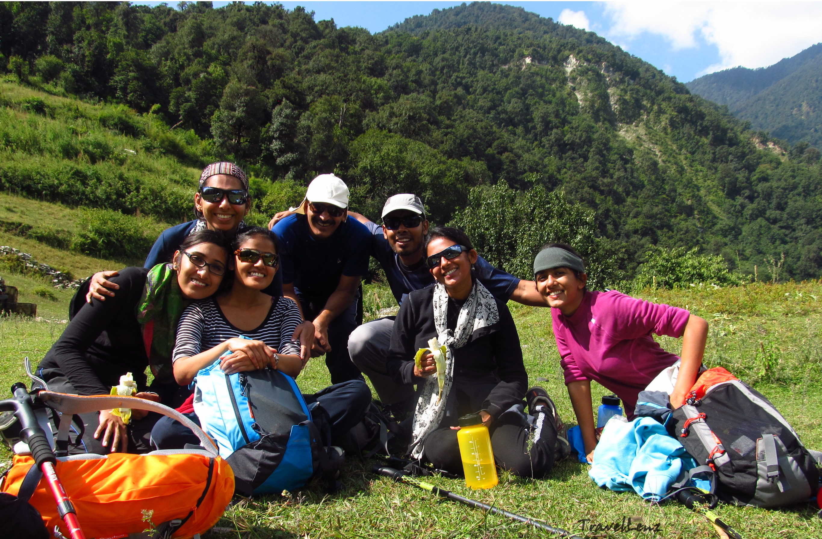 Trekkers resting at a clearing in the forest