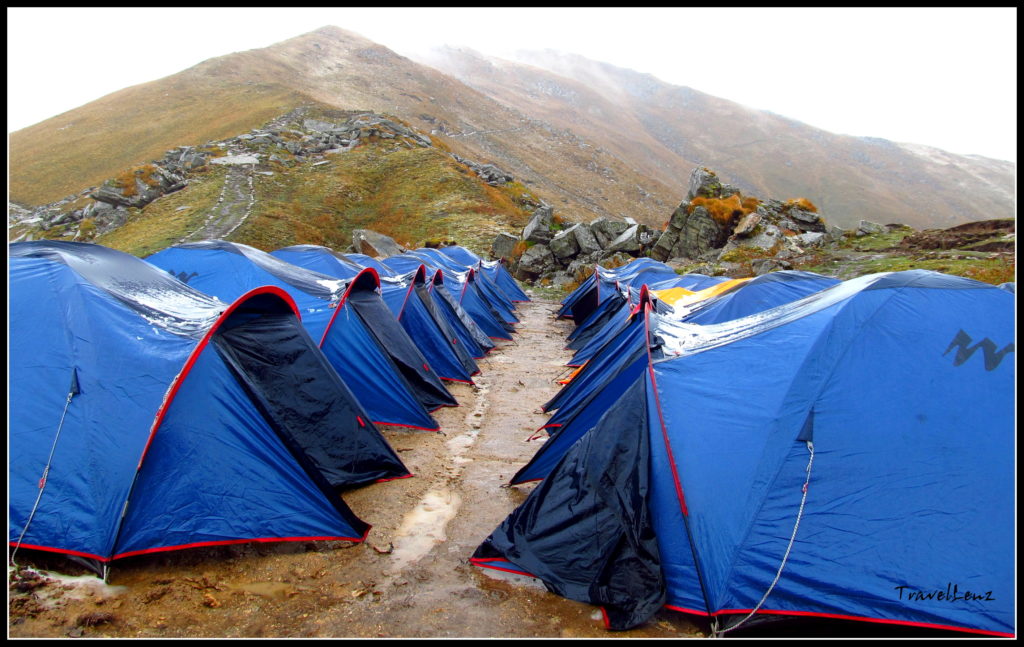 Row of tents facing each other on a campsite