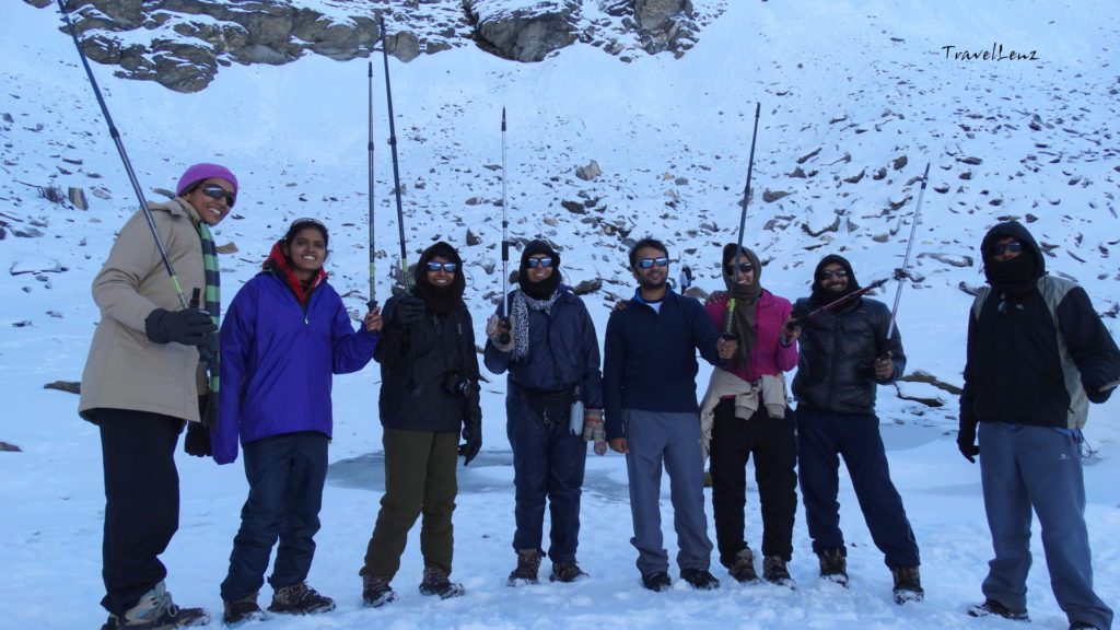 Trekkers pose in front of Roopkund lake