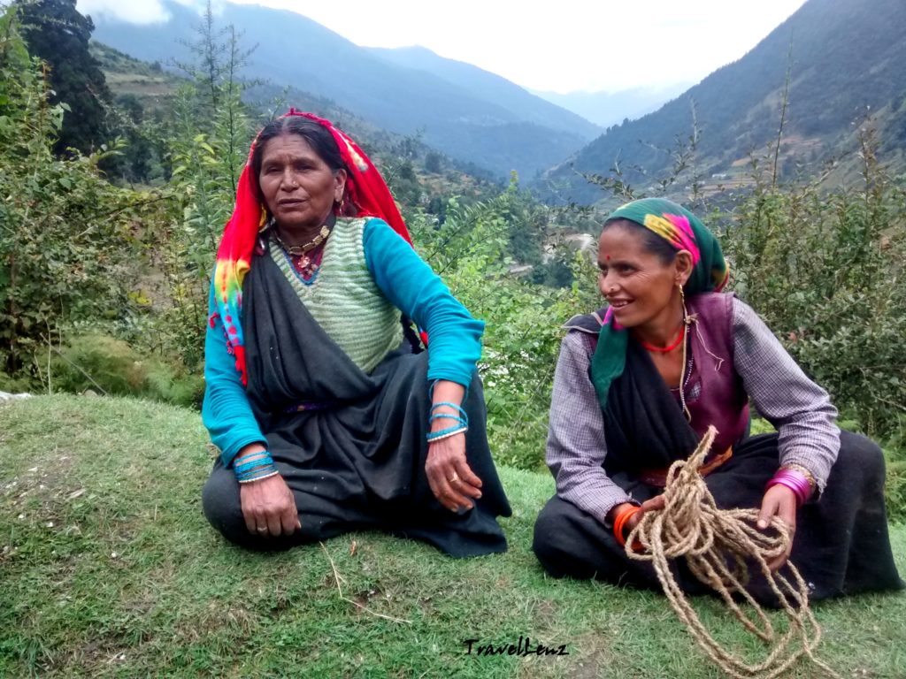 Two ladies sitting on the grass