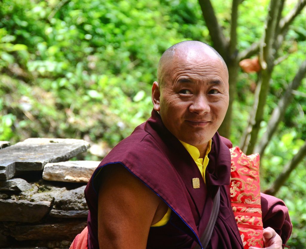 The smiling, serene face of a Bhutanese monk
