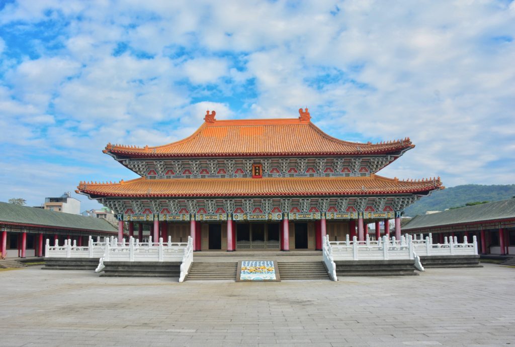 A big, beautiful monastery against a blue sky with clouds