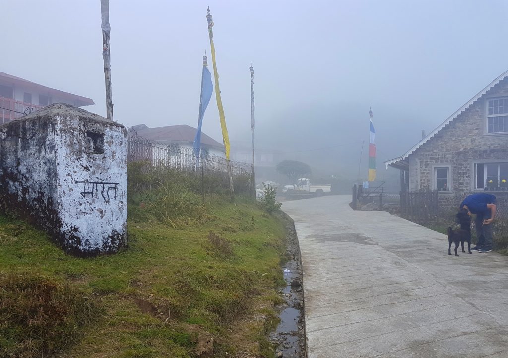 A sign post with India