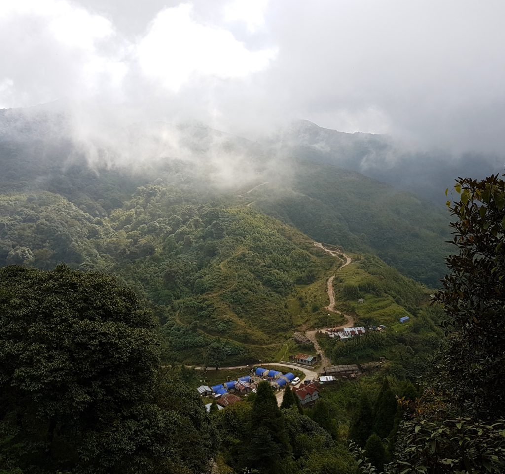 A zig-zag stone road traversing through a valley