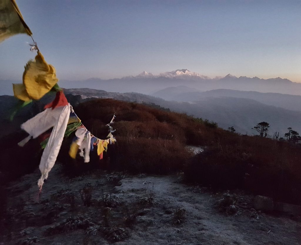 prayer flags and sleeping buddha